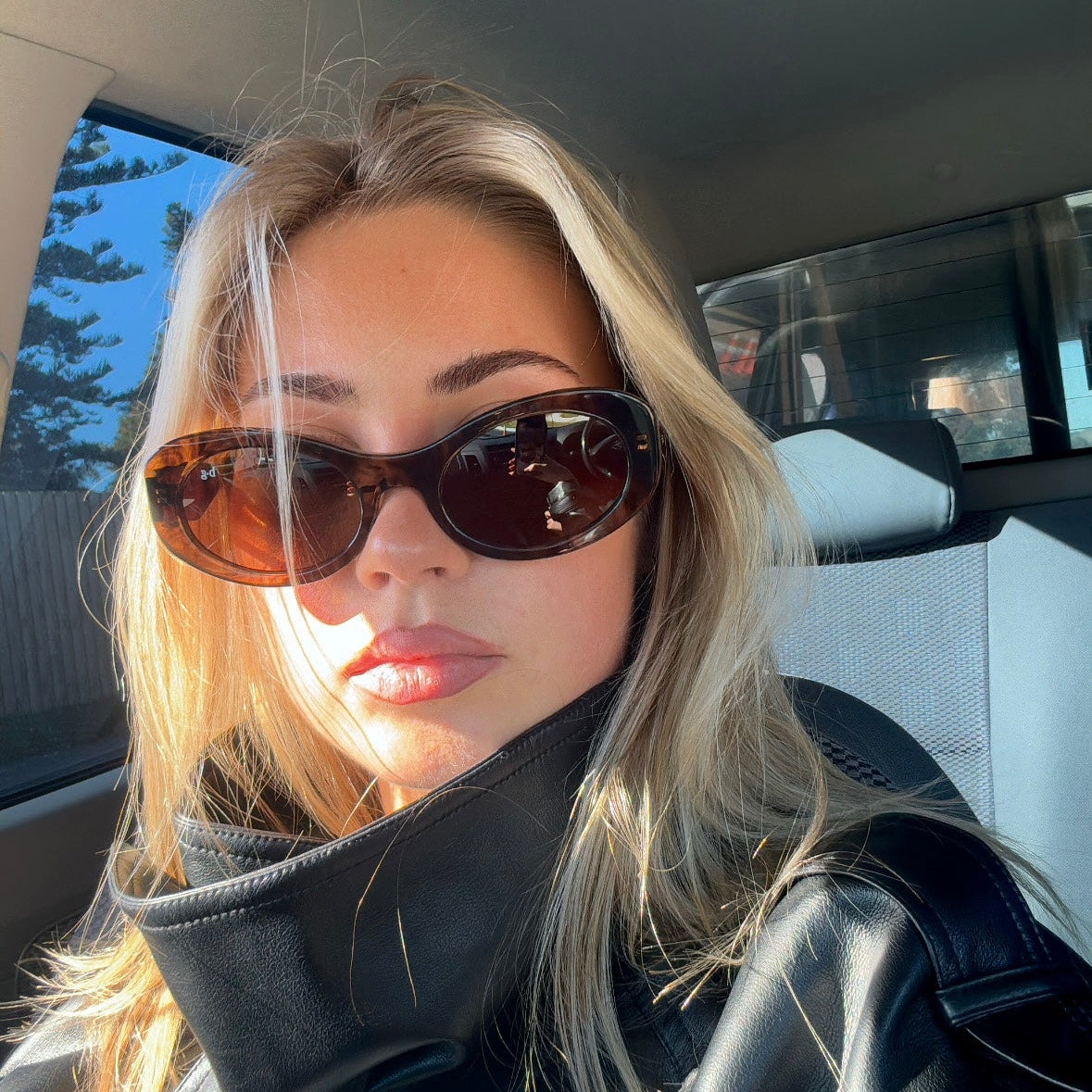 Close up of woman in polarised espresso chocolate oval Bored George sunglasses - timeless everyday style