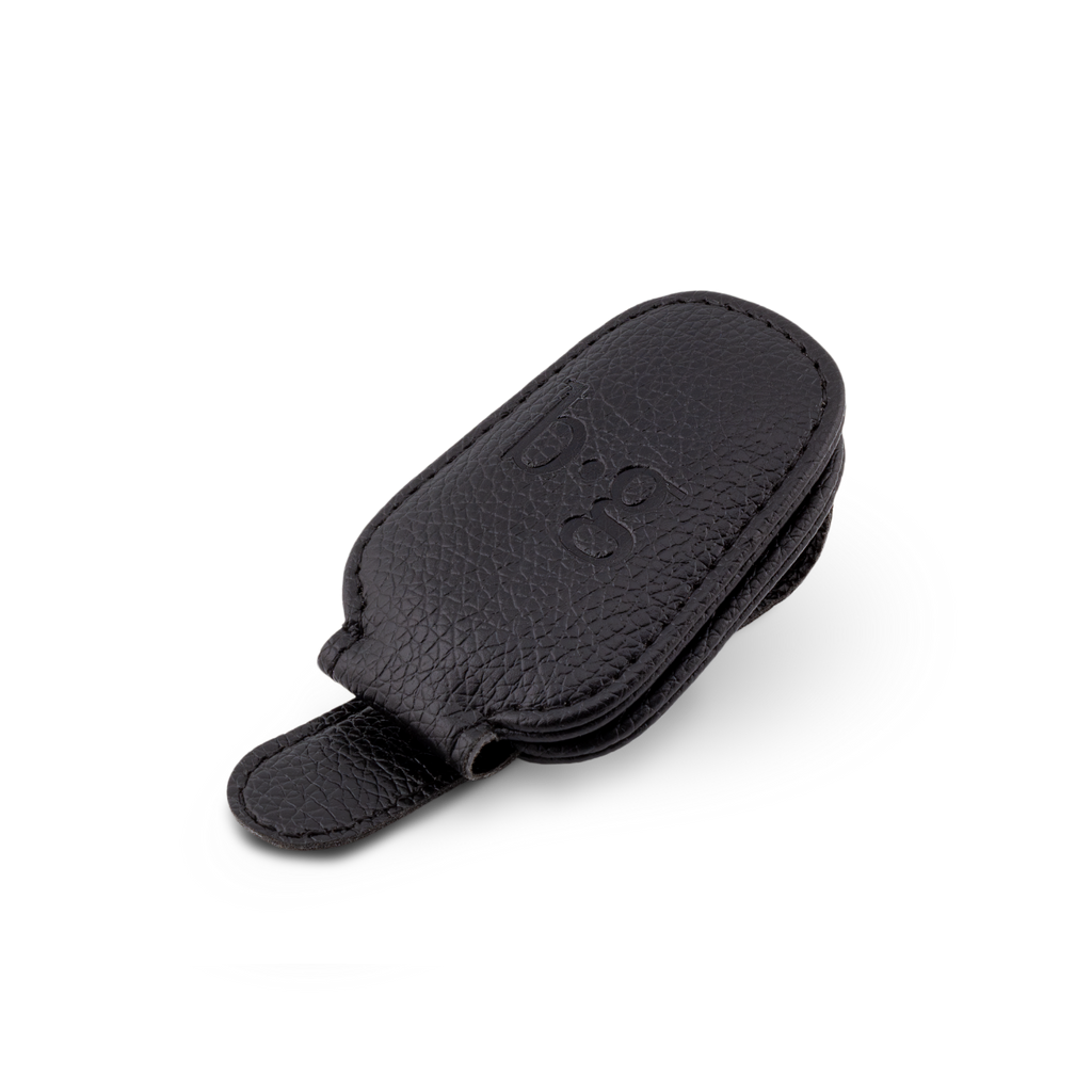Front view of a black car visor glasses holder