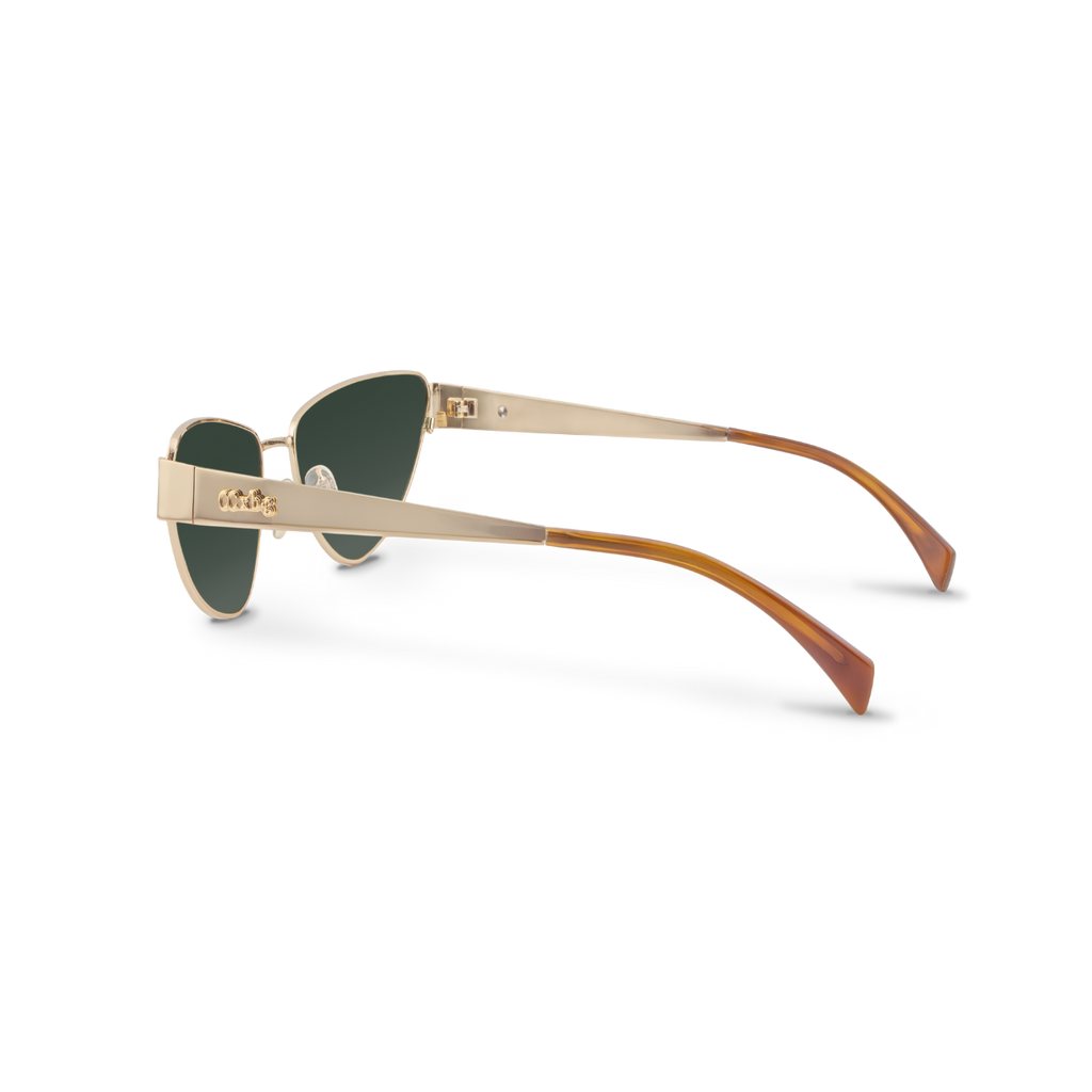 Left close-up of Bored George polarised cat eye Miu Miu style sunglasses with a lightweight gold metal frame and green lenses - collaboration with fashion designer Caitlin Crisp