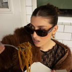 Close up of woman posing in polarised merlot Bored George sunglasses
