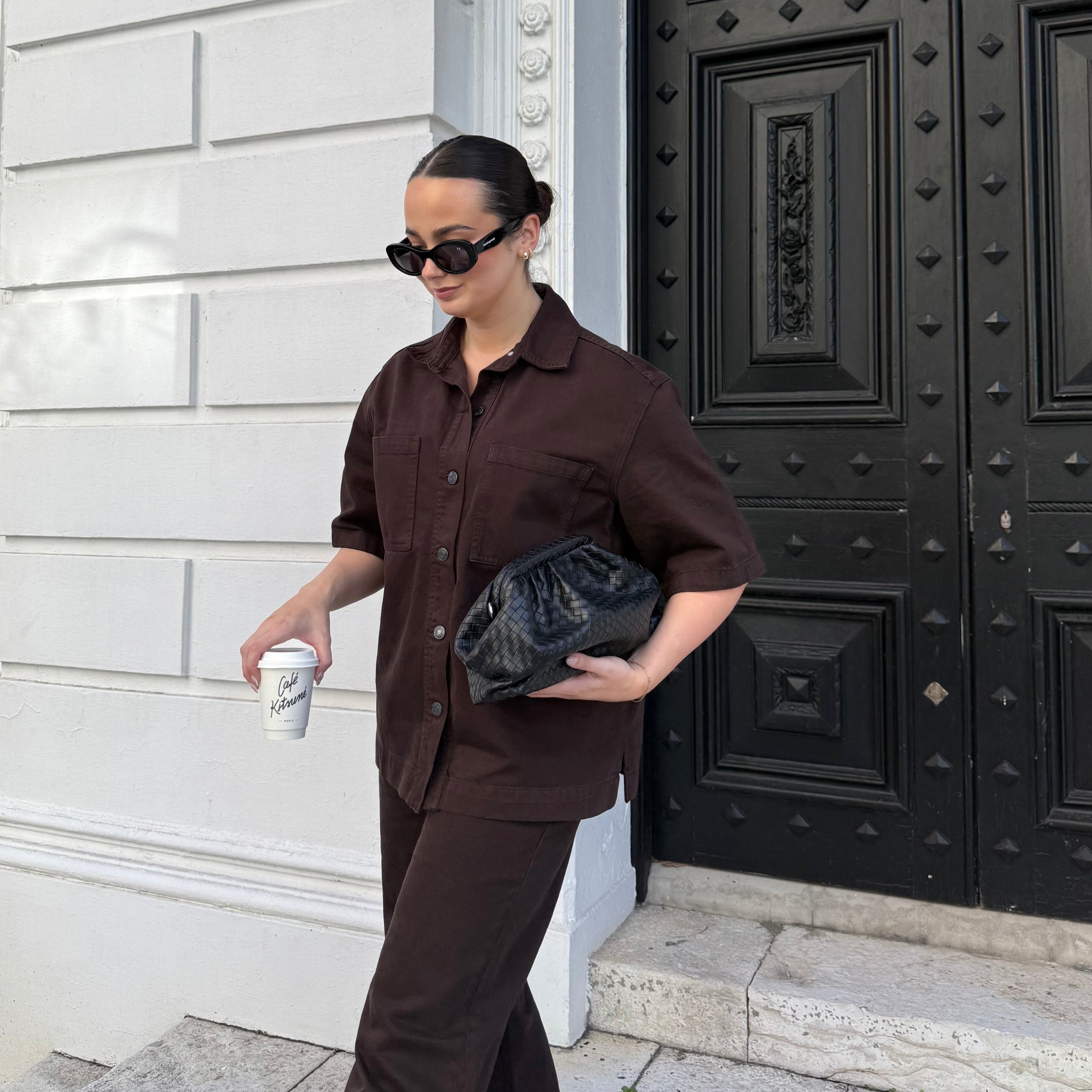 Woman wearing polarised black oval sunglasses. Bored George street style inspiration